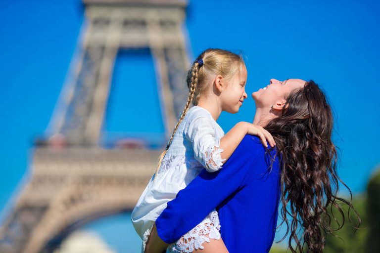 Happy family having fun in Paris background Eiffel Tower