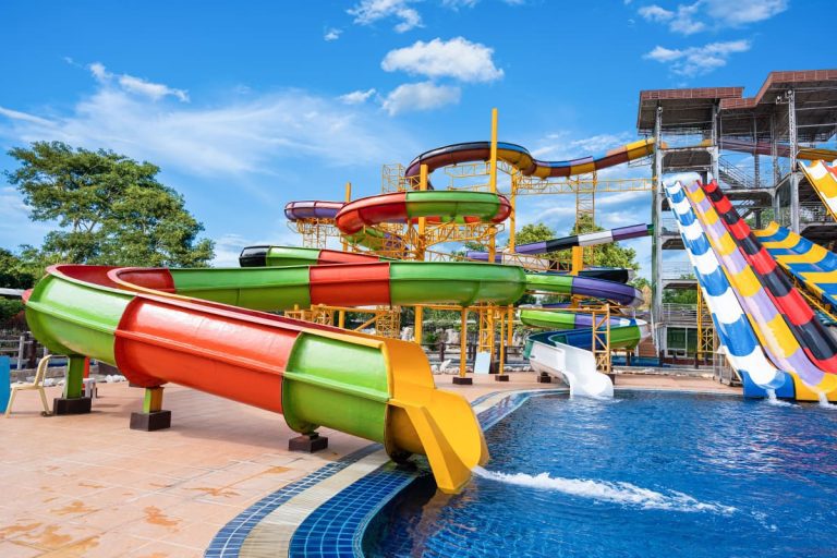 Swimming pool with water slides on sunny day